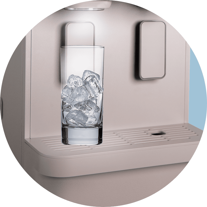 A glass of ice resting on the wider water tray of the Coway Lucy Plus