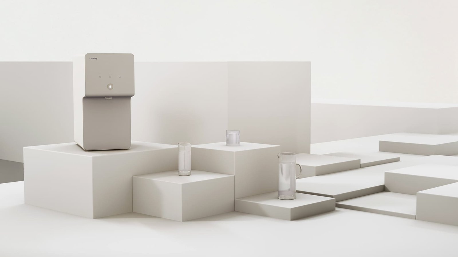 Coway Cinnamon on a podium beside glasses and a jug of water at different volumes